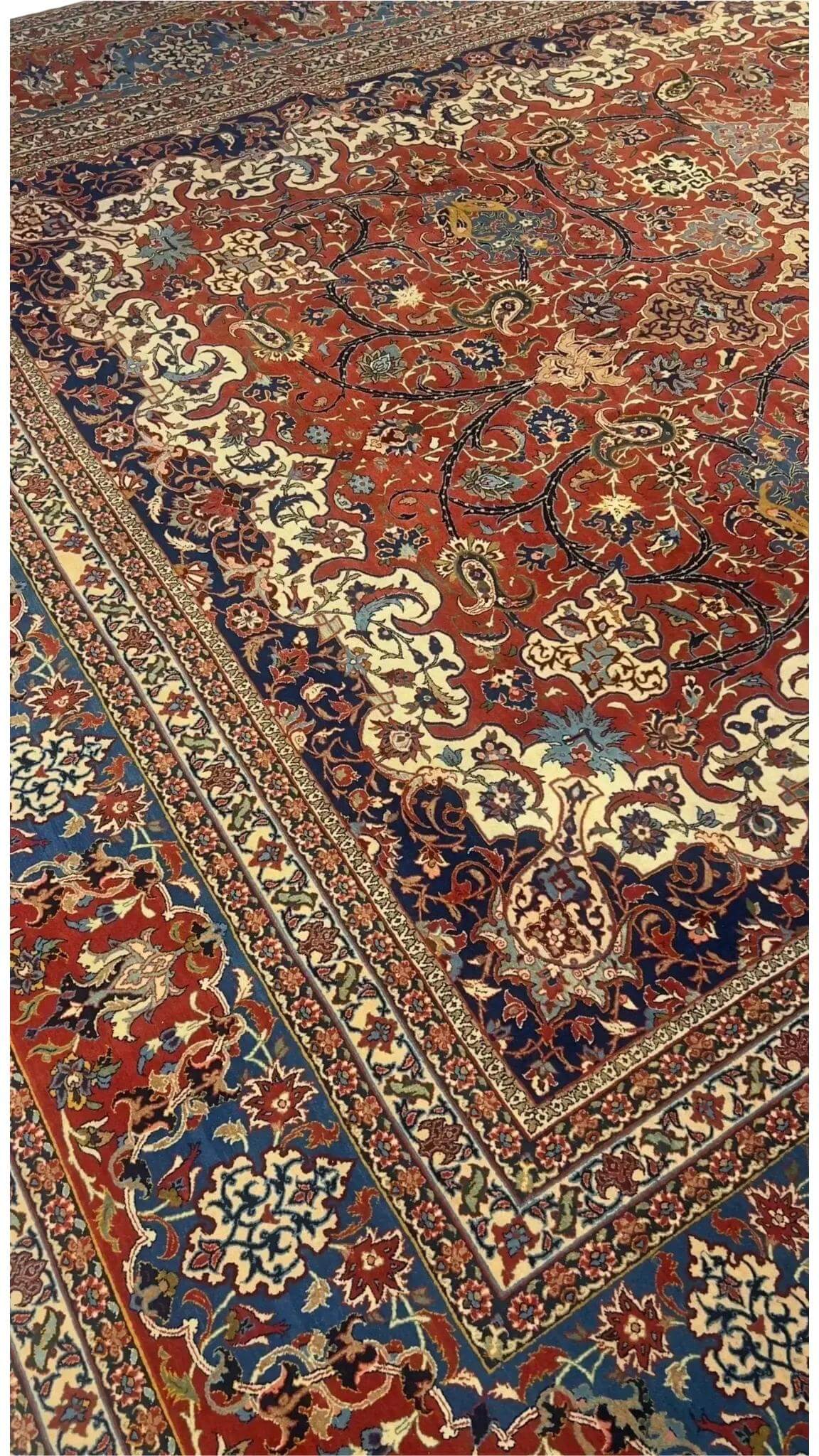 "Detailed view of luxury hand-knotted Isfahan rug with traditional mid-century motifs"